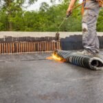 Bituminous membrane waterproofing system details and installation on flat rooftop.